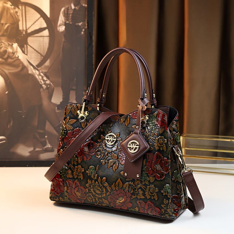 Vintage floral embossed handbag with top handles and shoulder strap